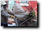 Picture of man moving bagged trash in shopping cart